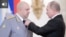 RUSSIA -- Russian President Vladimir Putin (R) decorates Commander of the Russian troops in Syria Colonel General Sergei Surovikin (L) during a ceremony to present state awards to Russian military servicemen who fought in Syria, at the Kremlin in Moscow