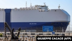 The MV Helios Ray cargo ship is seen docked in Dubai on February 28.