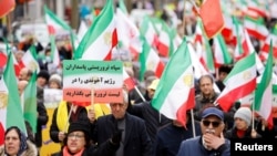 Ирандын Улуттук каршылык көрсөтүү кеңешинин жактоочулары нааразылык акциясына катышууда, Брюссель, Бельгия, 20-март, 2023-жыл. 