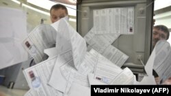 Ballot counting during an election in Novosibirsk in March. Electronic voting is being employed in many regions during regional elections being held from September 6-8. 