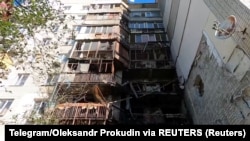 Zgrada pogođena u, kako su rekli ukrajinski zvaničnici, ruskim napadima 7. avgusta u Hersonu