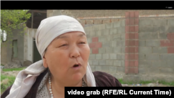 A Barak resident speaks shortly before leaving her home.