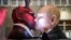 A carnival float depicts Russian President Vladimir Putin kissing the devil at a parade in Cologne, Germany, on February 14.