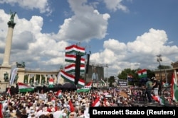 Supporters of Peter Magyar take part in a rally ahead of the European Parliament elections in Budapest on June 8.