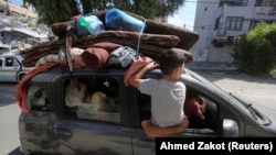 პალესტინელები მიდიან ღაზის სამხრეთ ნაწილში. 13 ოქტომბერი