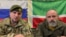 Командир чеченского спецназа "Ахмат" Апти Алаудинов и экс-командир отряда в ЧВК "Вагнер" Александр Кузнецов. Скриншот видео в телеграм-канале главы Чечни Рамзана Кадырова
