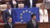 Moldova, Deputies holding EU flag in Parliament