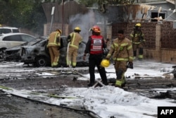 Ізраїльські пожежники і рятувальники працюють на місці ракетного обстрілу угрупованням ХАМАС південного ізраїльського міста Ашдод. 9 жовтня 2023 року