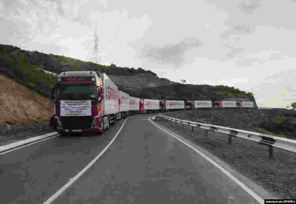 The truck convoy stopped on a road near Nagorno-Karabakh on July 26.&nbsp; The trucks reached an Azerbaijani checkpoint that was controversially set up in April on the Lachin Corridor, the main road connecting Armenia with Nagorno-Karabakh, but was prevented from driving through. The Azerbaijani Foreign Ministry has condemned the aid convoy as a &quot;provocation.&quot;&nbsp; &nbsp;