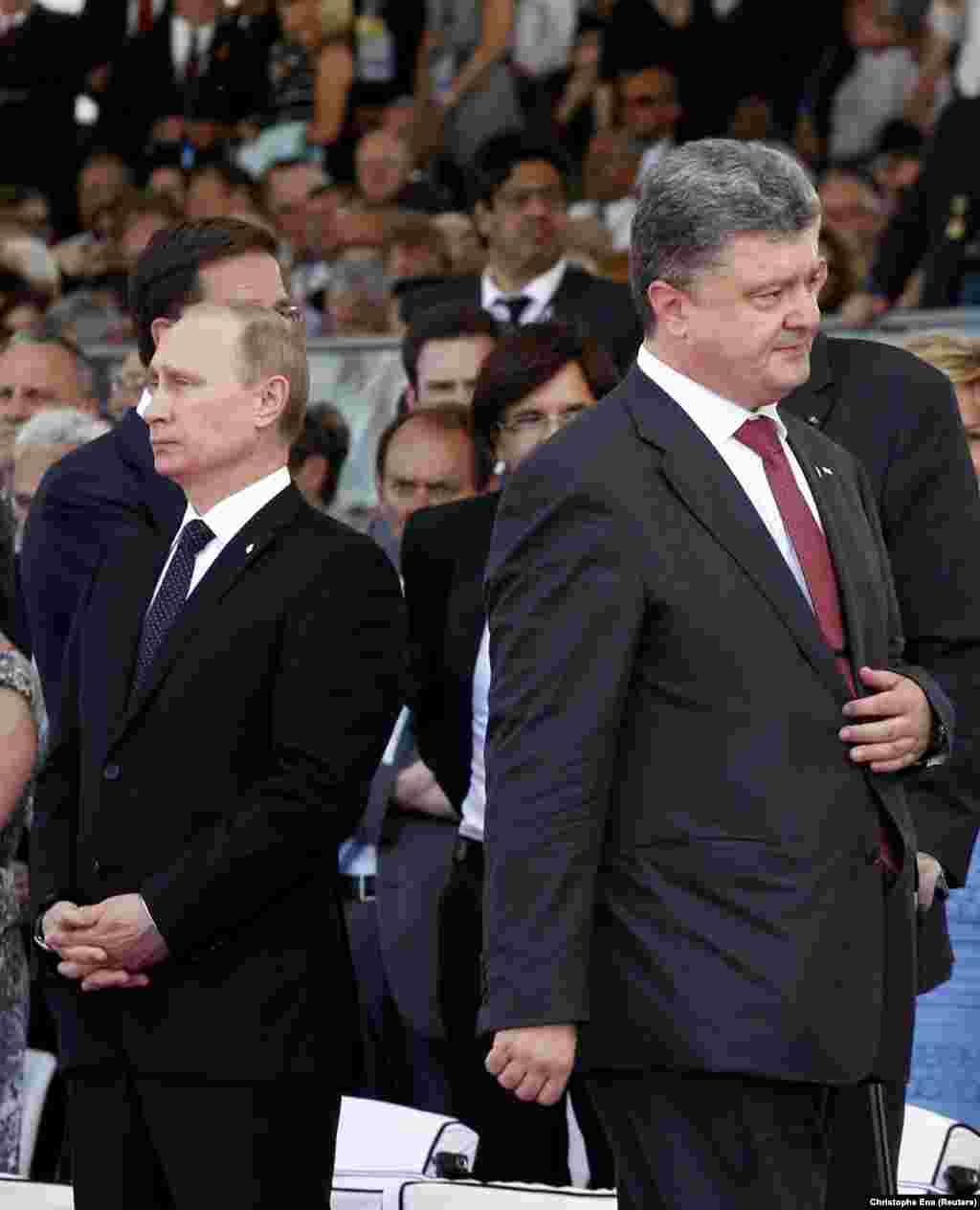 During the 70th anniversary in 2014, Ukraine&#39;s president-elect, Petro Poroshenko (right), walks past Russian President Vladimir Putin without acknowledging his presence amid tensions over Russia&#39;s illegal annexation of Crimea, which had occurred three months earlier. In an attempt to resolve the crisis sparked by Russia-backed separatists in eastern Ukraine and Moscow&#39;s annexation of Crimea, then-French President Francois Hollande had invited his Russian and Ukrainian counterparts in an effort to reduce tensions over the conflict.