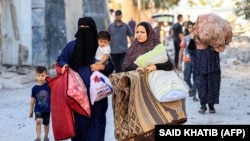პალესტინელები, რომლებიც თავიანთ საცხოვრებელ ადგილებს ტოვებენ. რაფაჰი, ღაზის სექტორი. 13 ოქტომბერი, 2013 წელი