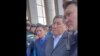 Депутаты мажилиса Ринат Заитов (слева), Ермурат Бапи и Максат Толыкбай (справа) вышли на диалог с протестующими нефтяниками из Жанаозена