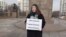 Activist Kamila Yensegen holds a single picket on Republic Square in Almaty, demanding approval of the women's march. February 14, 2024