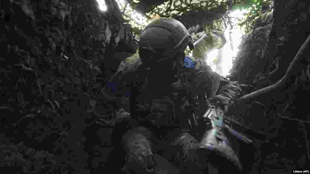 A Ukrainian soldier jumps into a trench to escape Russian shelling. &quot;Our main task is to ensure reliable defense, to prevent the loss of our strongholds and positions in the Kupyansk and Lyman directions, as well as to successfully move forward and reach the designated lines in the Bakhmut direction,&quot;&nbsp;Syrskiy said.