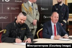 Олександр Камишін міністр стратегічних галузей промисловості України, та Ніколя Шамуссі з компанії Nexter Group. Київ, 29 вересня 2023 року