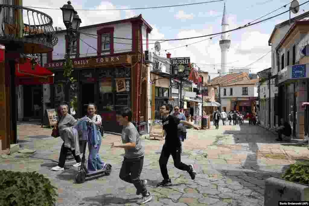 Children play on a street near Skopje's Old Bazaar in North Macedonia. 