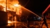Рятувальники борються з пожежею, яка атаки дронами в Харкові, 4 травня 2024 року 