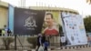 Žena prolazi pored bilborda koji prikazuje sirijskog predsjednika Bashara al-Assada u Damasku, Sirija, 11. novembra 2022. 