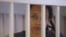 U.S. basketball player Brittney Griner sits inside a defendants' cage as she is given a nine-year prison sentence in Moscow on August 4.
