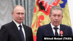 Vladimir Putin și Ravil Maganov, pe 21 noiembrie 2019.