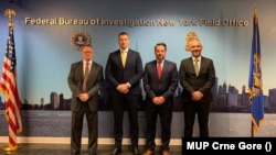 Ministar unutrašnjih poslova Filip Adžić i direktor Uprave policije Zoran Brđanin sa predstavnicima FBI, 30. avgusta 2022. kada je dogovorena saradnja zbog sajber napada u Crnoj Gori. 