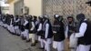Prisoners line up at the Pul-e Charkhi prison after their release in Kabul on January 11.