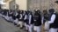 Prisoners line up at the Pul-e Charkhi prison after their release in Kabul on January 11.