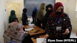 Women wait to vote in a women's voting center during the presidential election on September 28.