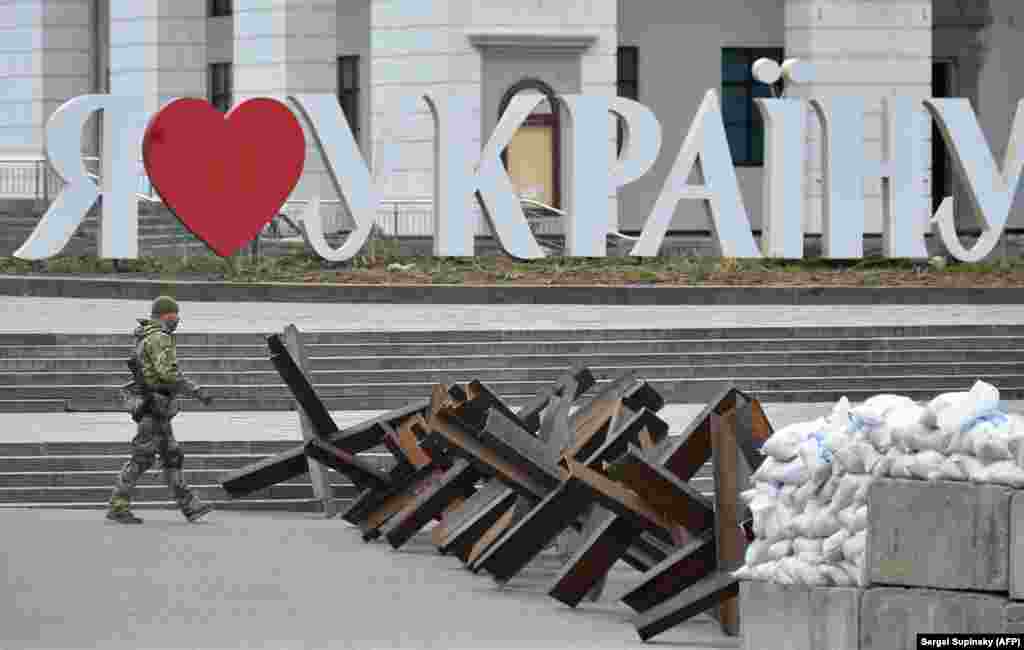 Czech &quot;hedgehogs&quot; line a pavement in front of a sign saying, &quot;I Love Ukraine,&quot; in central Kyiv on March 7.&nbsp;