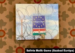 A kiállított kép: „Határ a szerb Rastina és a magyar Bácsszentgyörgy között”.