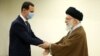 Syrian President Bashar al-Assad (left) greets Supreme Leader Ayatollah Ali Khamenei in Tehran on May 8.