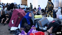 گزارش تصویری از موج مهاجران افغان اخراج‌شده از ایران