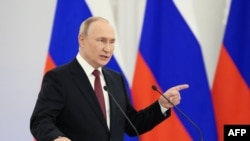 Președintele rus Vladimir Putin anunțând, într-un discurs la Kremlin, anexarea regiunilor ucrainene Donețk, Luhansk, Zaporojie și Herson, Moscova, 30 septembrie 2022.