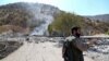 A Kurdish peshmerga fighter inspects the damage following an Iranian cross-border attack in the area of Zargwez, where several exiled left-wing Iranian Kurdish parties maintain offices, around 15 kilometers from the Iraqi city of Sulaymaniyah on September 28.