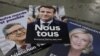 Posterët e tre kandidatëve kryesorë në zgjedhjet franceze: Emmanuel Macron, Marine Le Pen dhe Jean-Luc Mélenchon.
