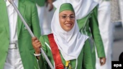 Бейжің олимпиадасында өз елінің туын ұстап шыққан ирандық спортшы Хома Хоссейни. 8 тамыз 2008 жыл. Көрнекі сурет