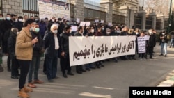 After suffering losses in recent months amid Iran's crumbling economy, shareholders protested outside the parliament building in Tehran on January 20.