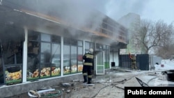 Emergency personnel extinguish the fire in Ufa on February 9.