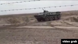 A video grab shows a military vehicle stationed on the Turkmen side of the Turkmen-Afghan border in December 2021.