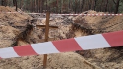 Ukrainians Find Bodies With Hands Tied In Mass Burial Site Near Izyum