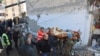 ALBANIA -- Military and emergency personnel carry an injured man on a stretcher near a damaged building in Thumane, after an earthquake shook Albania, November 26, 2019