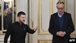 Президент Володимир Зеленський (ліворуч) і лідер німецької партії ХДС/ХСС Фрідріх Мерц у Києві, грудень 2024 року 