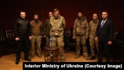 Azovstal defenders, together with Ukraine's Military Intelligence chief Kyrylo Budanov (right), speak with Ukrainian President Volodymyr Zelenskiy via video link from Turkey after the prisoner exchange.