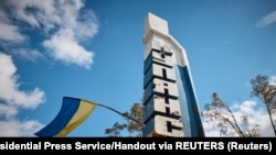 Steagul Ucrainei, arborat la intrarea în localitatea Kupiansk, recent eliberată de sub ocupație rusească, 19 septembrie 2022.