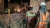 Rescuers remove debris in the hopes of finding survivors trapped in the rubble of the Metropol building in Abadan on June 2.