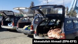 FILE: Cars are loaded with the bodies of civilians allegedly killed in a military operation by international forces in Zurmat district of Paktia province in December 2018.