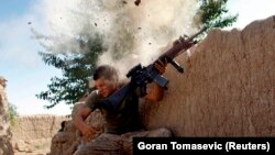 Mullah Manan commanded Taliban fighters as they steadily increased their control over Helmand in the years following the end of most international combat missions in 2014. FILE: A U.S. Marine being shot at in Helmand.