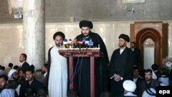 Muqtada al-Sadr speaks during Friday Prayers at the Al-Kufah Mosque in Al-Najaf in 2006.