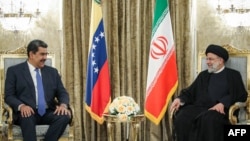 Venezuelan President Nicolas Maduro (left) meets with his Iranian counterpart, Ebrahim Raisi, in Tehran on June 11. 