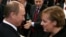 Russian President Vladimir Putin talks to German Chancellor Angela Merkel during the 43rd Munich Conference on Security Policy in 2007, the only time the Kremlin leader attended the event. 